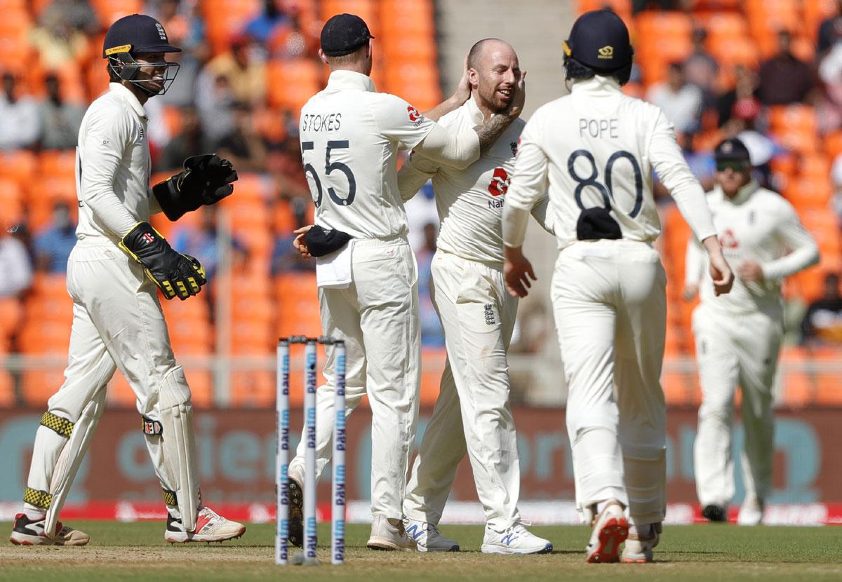 England's players celebrate the dismissal of Ajinkya Rahane