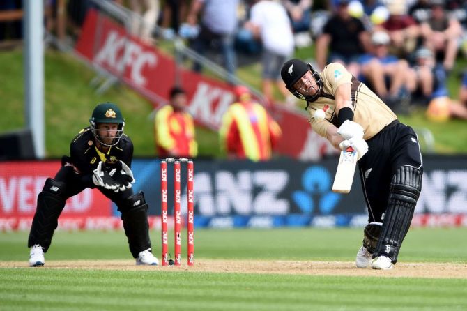 New Zealand's Martin Guptill dances down the pitch to hoick the ball en route his 50-ball 97 in the 2nd T20I against Australia on Thursday