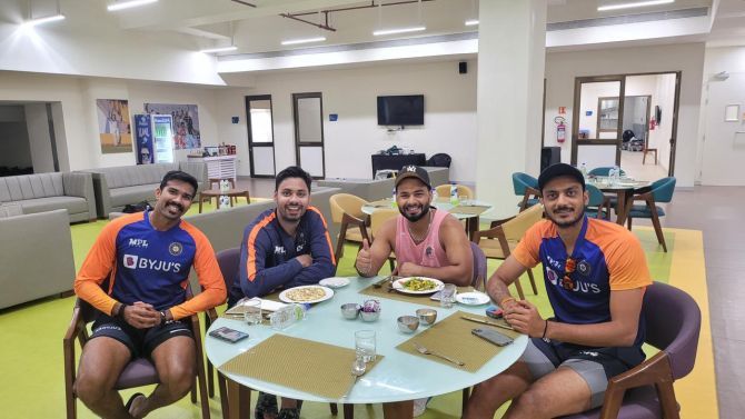 Rishabh Pant with Axar Patel and reserve bowlers Sandeep Warrier and Avesh Khan