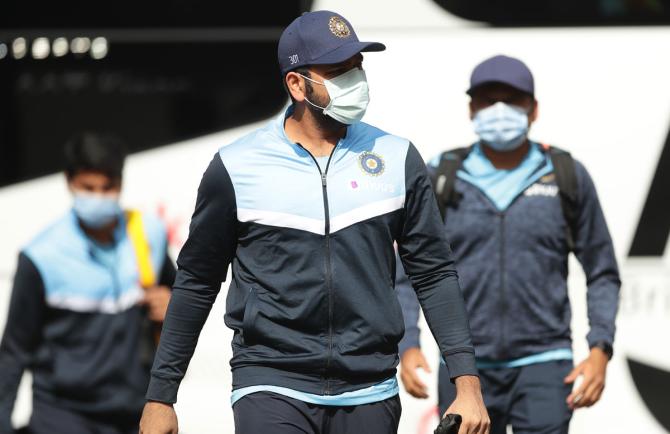 Rohit Sharma wears a mask as he arrives for the Indian net session at Sydney Cricket Ground