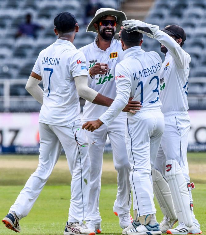 Sri Lanka players celebrate the dismissal of Quinton de Kock during Day 2 of the 2nd Test (WTC) match against South Africa at Imperial Wanderers in Johannesburg on Tuesday