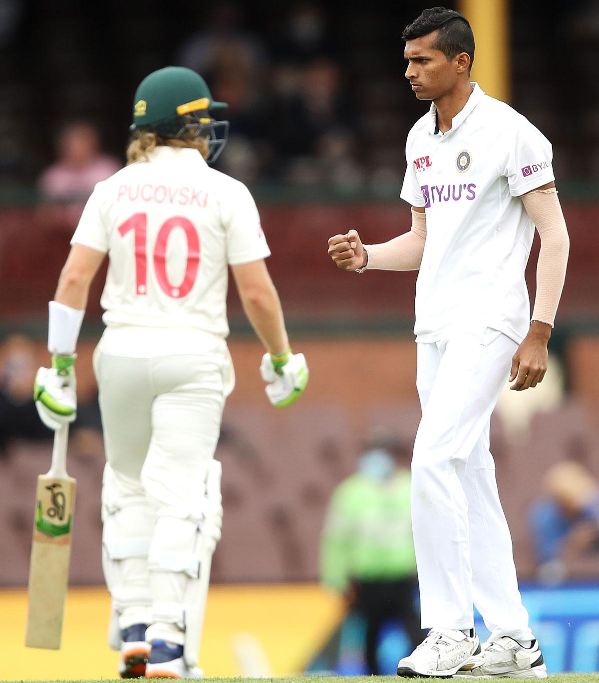 India pacer Navdeep Saini celebrates after trapping Australia opener Will Pucovski leg before wicket 