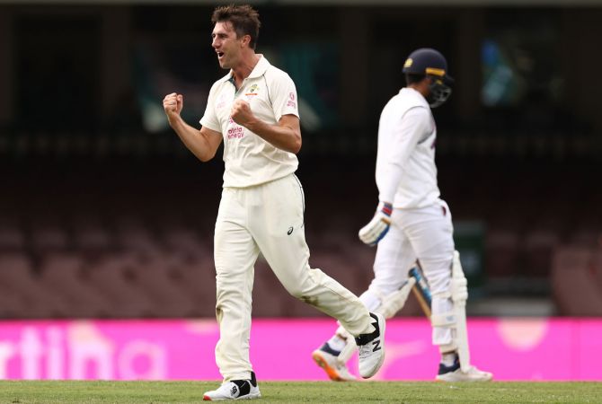 Pat Cummins celebrates after taking the wicket of Shubman Gill
