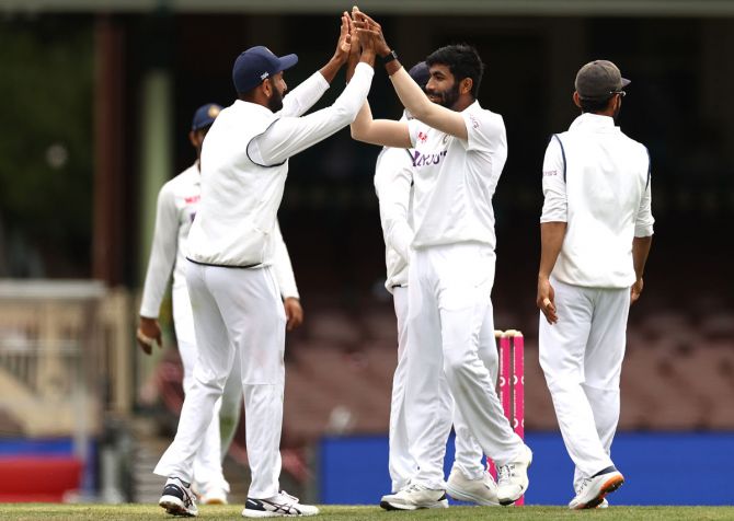India pacer Jasprit Bumrah gets a high-five from his teammates after dismissing Cameron Green.