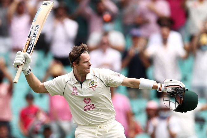 Steve Smith exults after getting to hundred during Day 2 of the third Test between Australia and India, at the Sydney Cricket Ground, on Friday. 