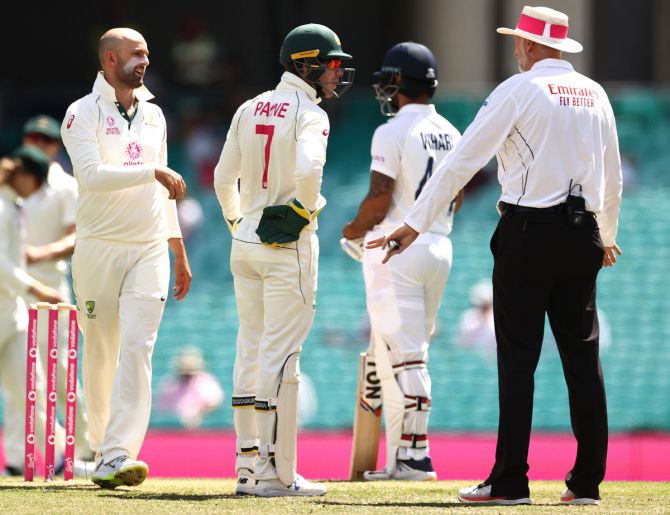 Australia captain Tim Paine questions umpire Paul Wilson over a DRS referral against Cheteshwar Pujara during Day 3 of the third Test against India, at the Sydney Cricket Ground, on Saturday.