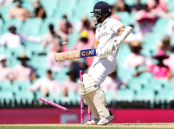 Ajinkya Rahane is bowled by Pat Cummins