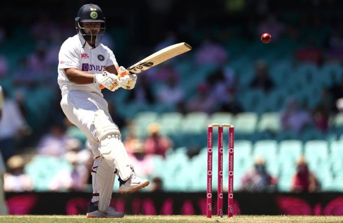India batsman Rishabh Pant reacts after being struck by a delivery from Pat Cummins during Day 3 of the third Test against Australia, at the Sydney Cricket Ground, on Saturday.