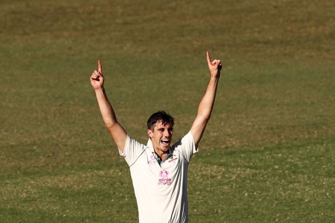 Australia pacer Pat Cummins exults after dismissing Rohit Sharma in India's second innings.