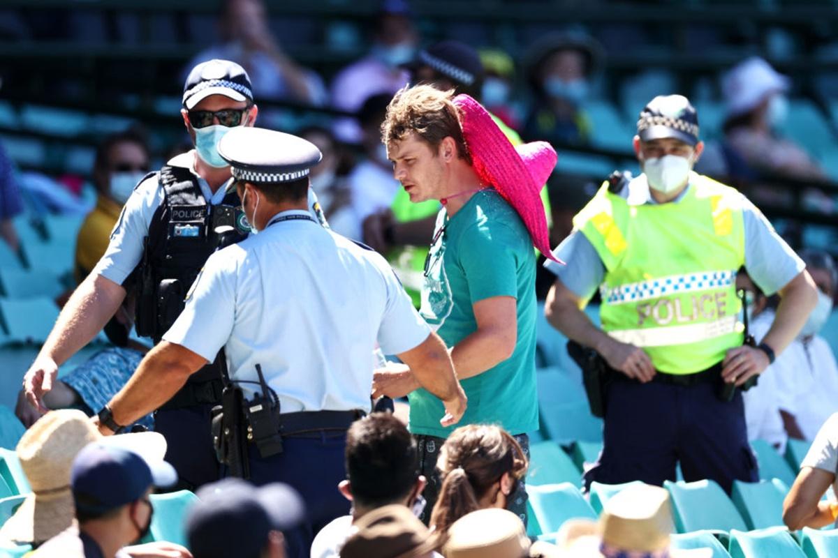 Police speak to spectators following a complaint from Mohammed Siraj that stopped play during Day 4