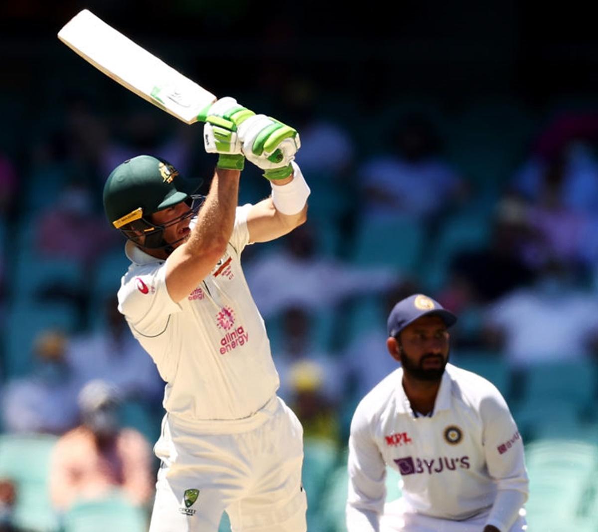 Tim Paine hoists one to the boundary. 