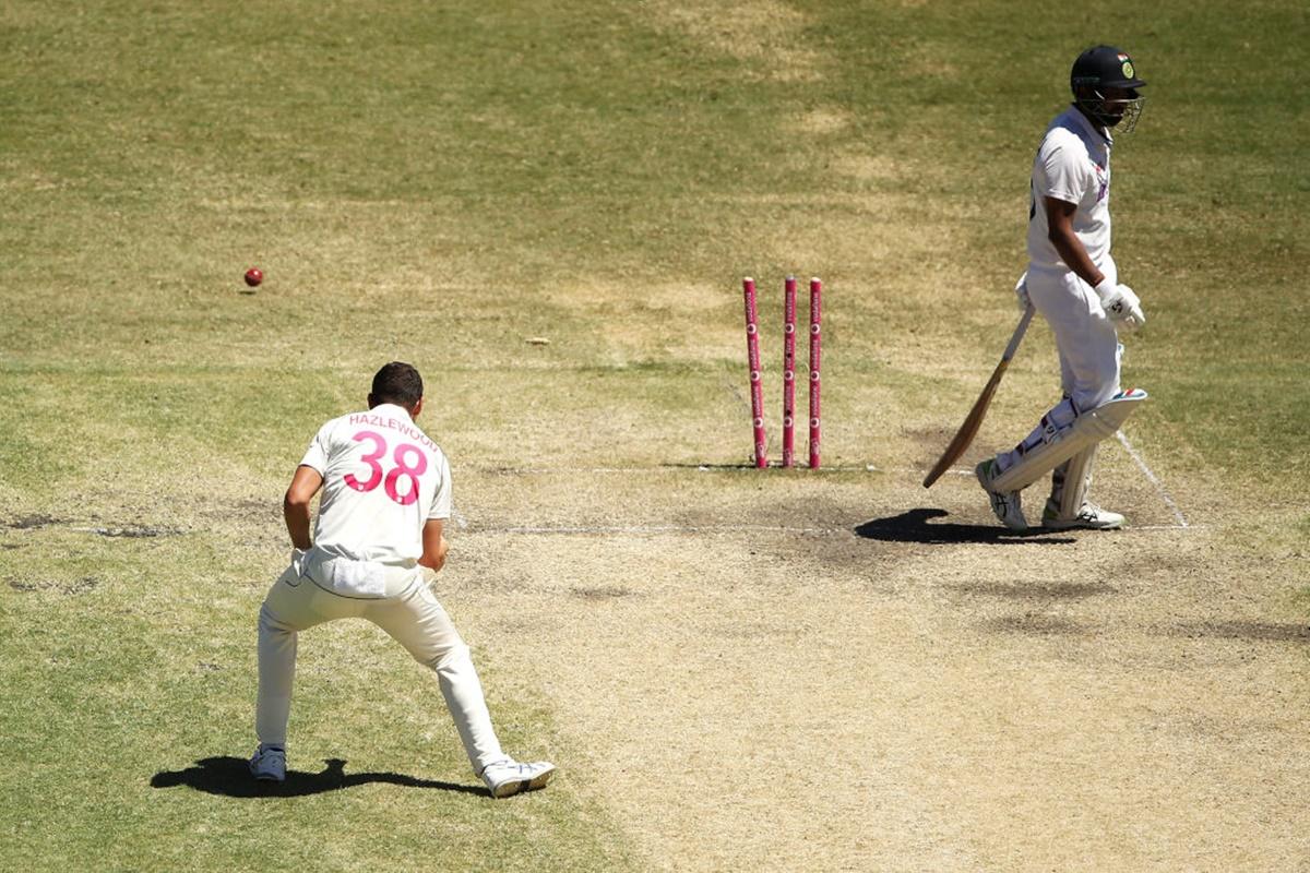 Josh Hazlewood celebrates after shattering Cheteshwar Pujara's stumps.