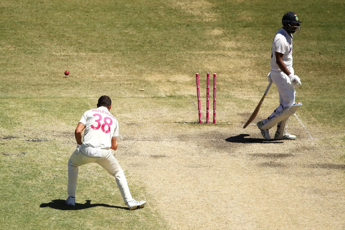 Josh Hazlewood celebrates after shattering Cheteshwar Pujara's stumps.