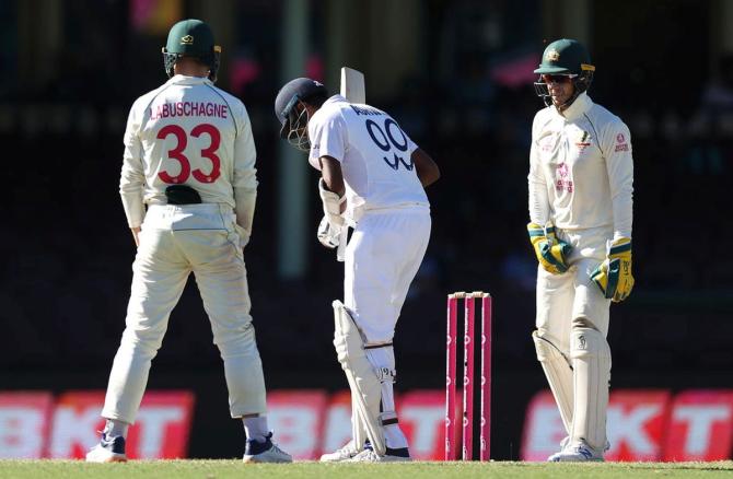 Australia captain Tim Paine mouths sweet nothings to India's Ravichandran Ashwin on Day 5 of the 3rd Test match at the Sydney Cricket Ground in Sydney