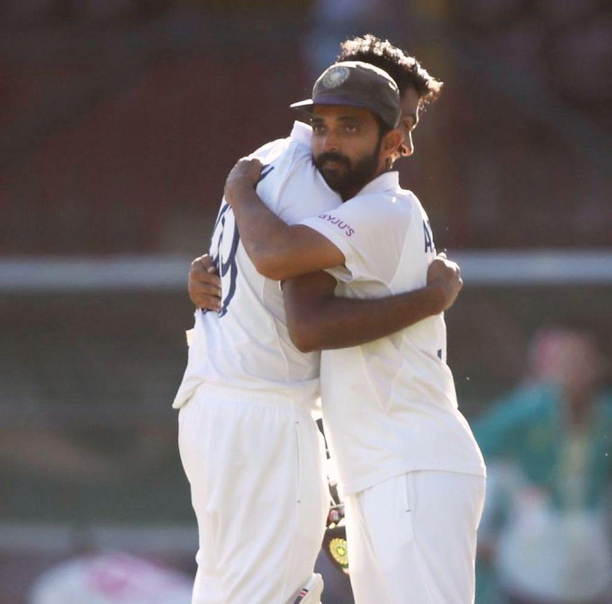 India's stand-in skipper Ajinkya Rahane congratulates Ravichandran Ashwin after pulling off a draw in the 3rd Test at the SCG