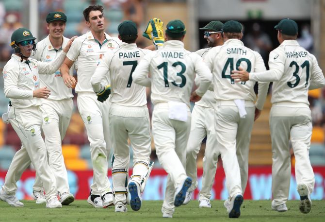 Australia pacer Pat Cummins celebrates after taking the wicket of India opener Shubman Gill