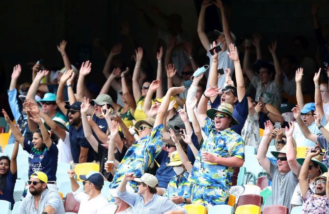 Crowds perform the wave on Day 2 of the 4th Test at The Gabba on Saturday