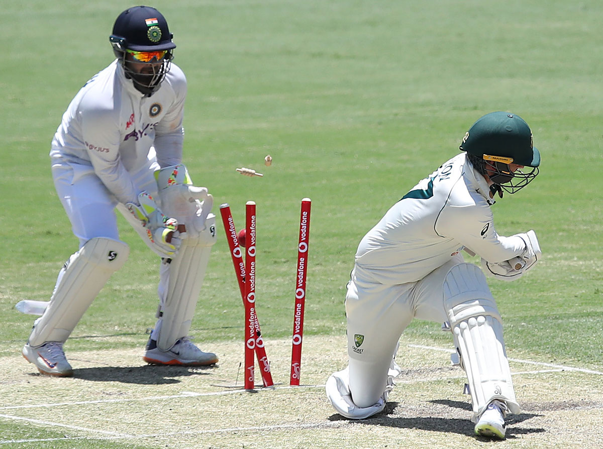 Nathan Lyon is bowled by Washington Sundar.