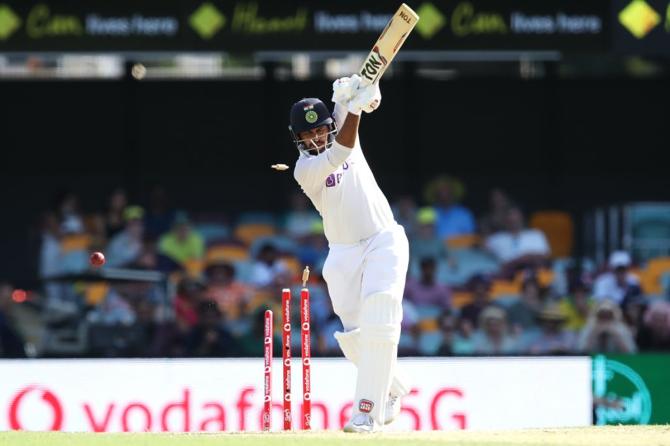 Shardul Thakur is bowled by Pat Cummins.