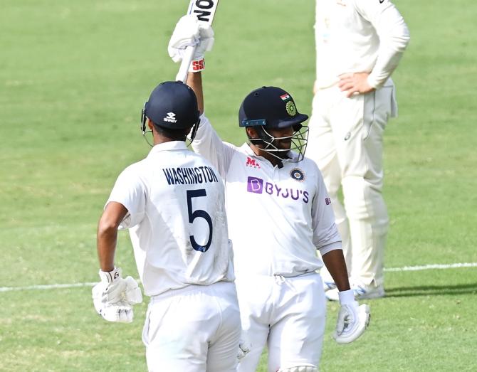 Shardul Thakur waves to the dressing room after scoring 50.