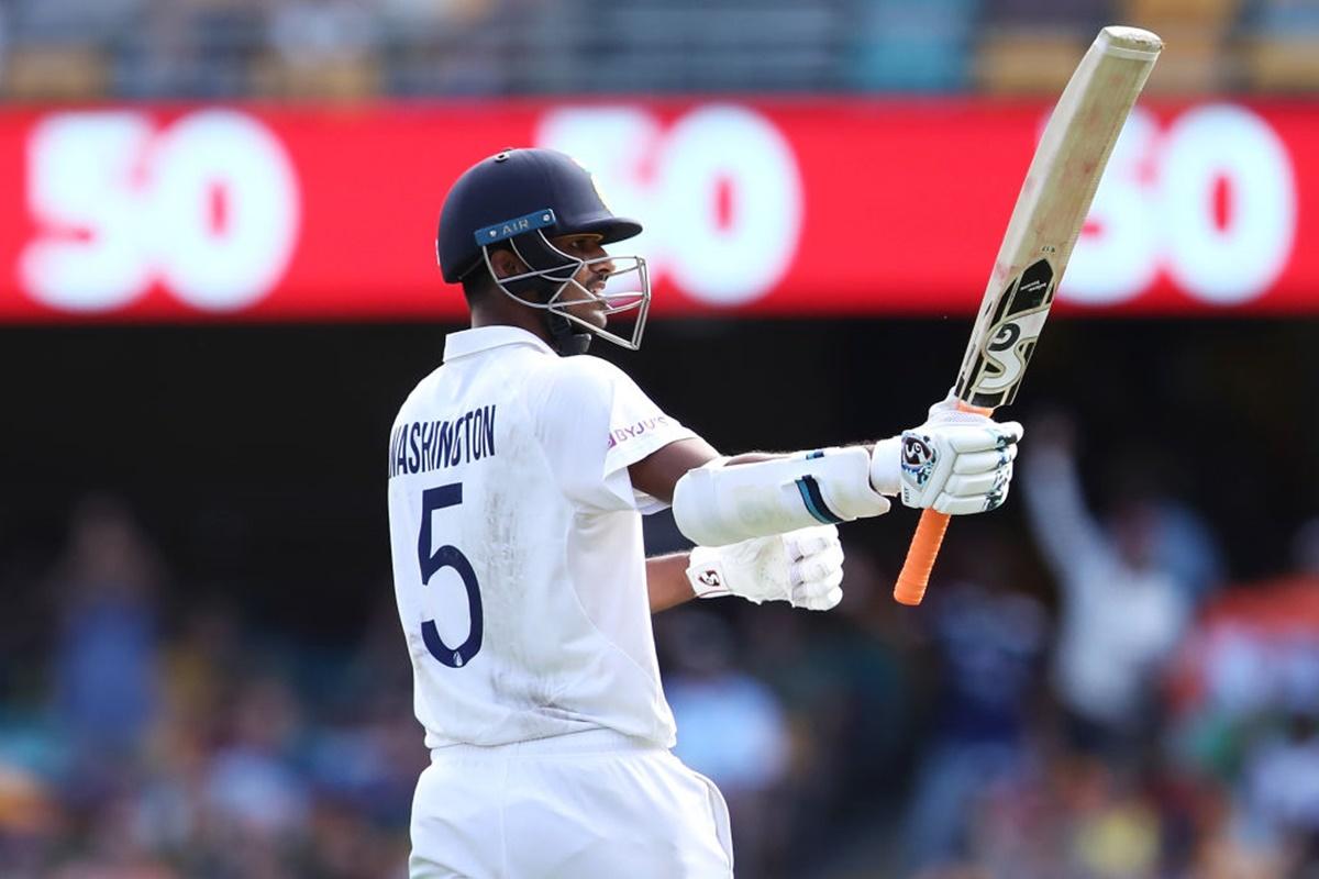 Washington Sundar celebrates his half century during Day 3 of the fourth Test against  Australia,  at the Gabba, in Brisbane, on Sunday.