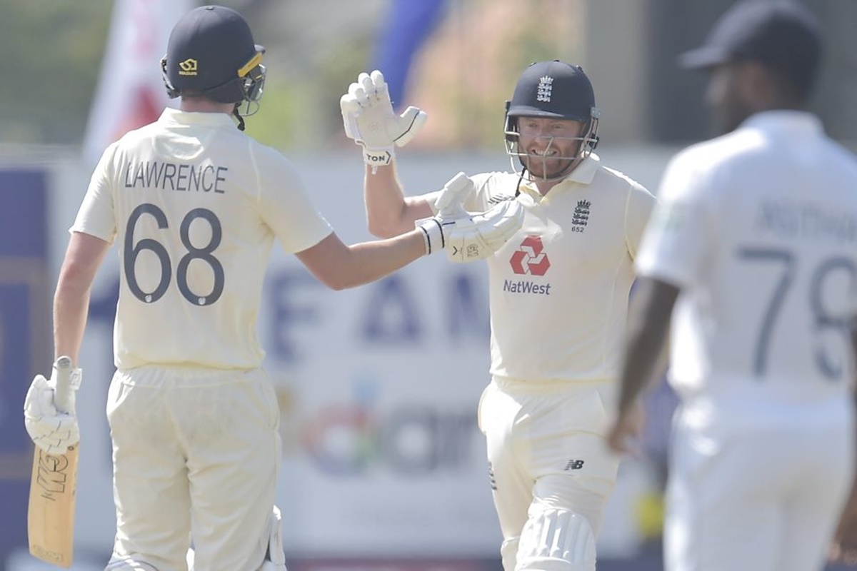 England’s Jonny Bairstow and debutant Dan Lawrence celebrate after knocking off the required runs to win the first Test against Sri Lanka, in Galle, on Monday