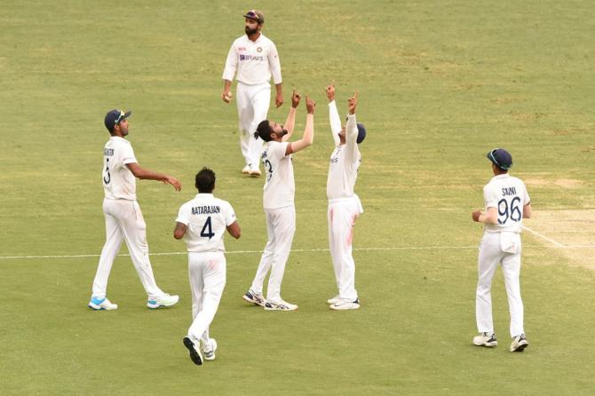 Mohammed Siraj celebrates after dismissing Josh Hazlewood and picking his fifth wicket in the second innings of the 4th Test at the Gabba 