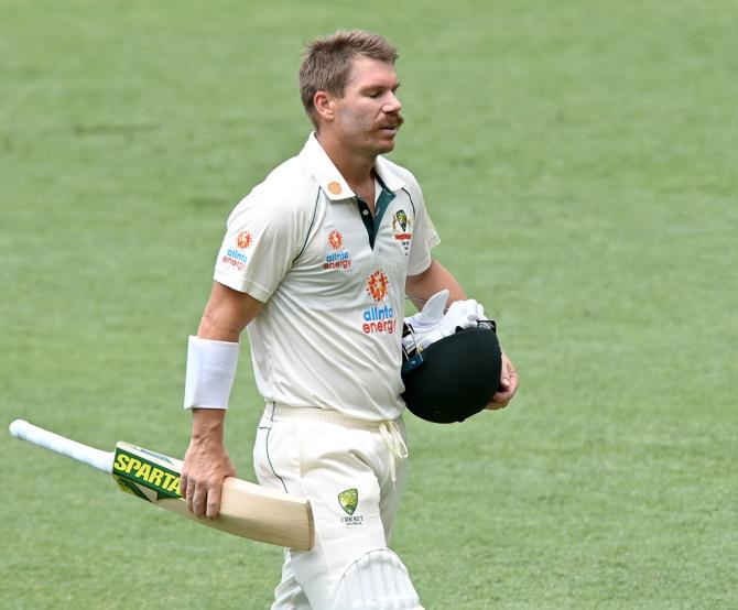 David Warner walks back after being trapped leg before wicket by Washington Sundar.