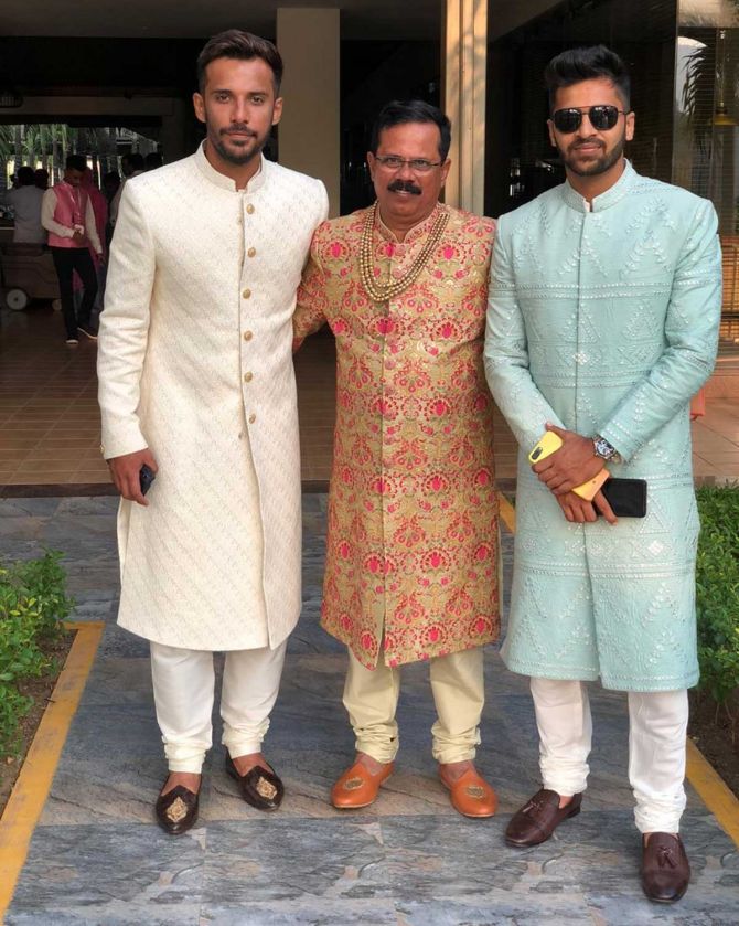 Shardul Thakur, right, with Coach Dinesh Lad, centre, and a friend at a wedding.