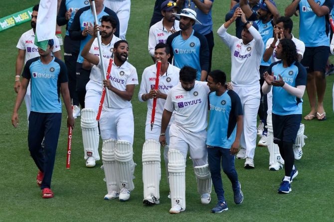 The Indian team take a lap of honour around The Gabba on Tuesday