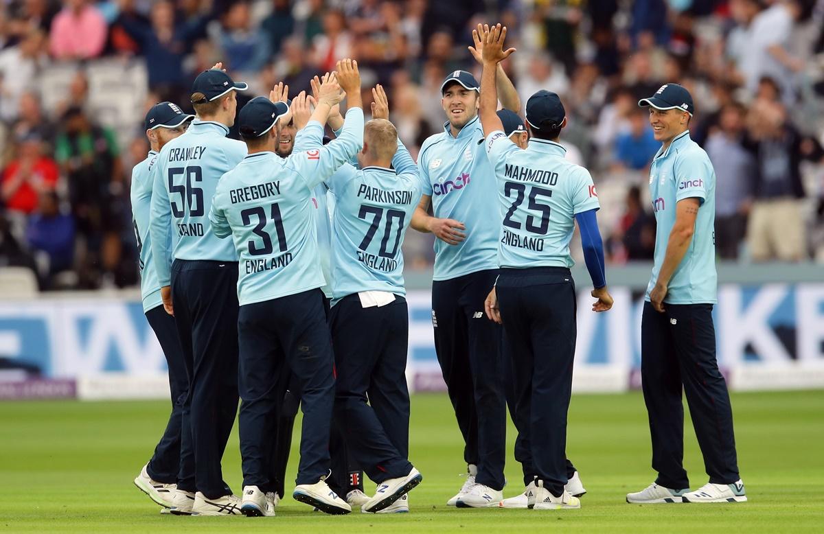 England's Craig Overton celebrates taking the catch to dismiss Pakistan's Saud Shakeel off the bowing of Matt Parkinson in the second One-Day International, at Lord's, London, on Saturday