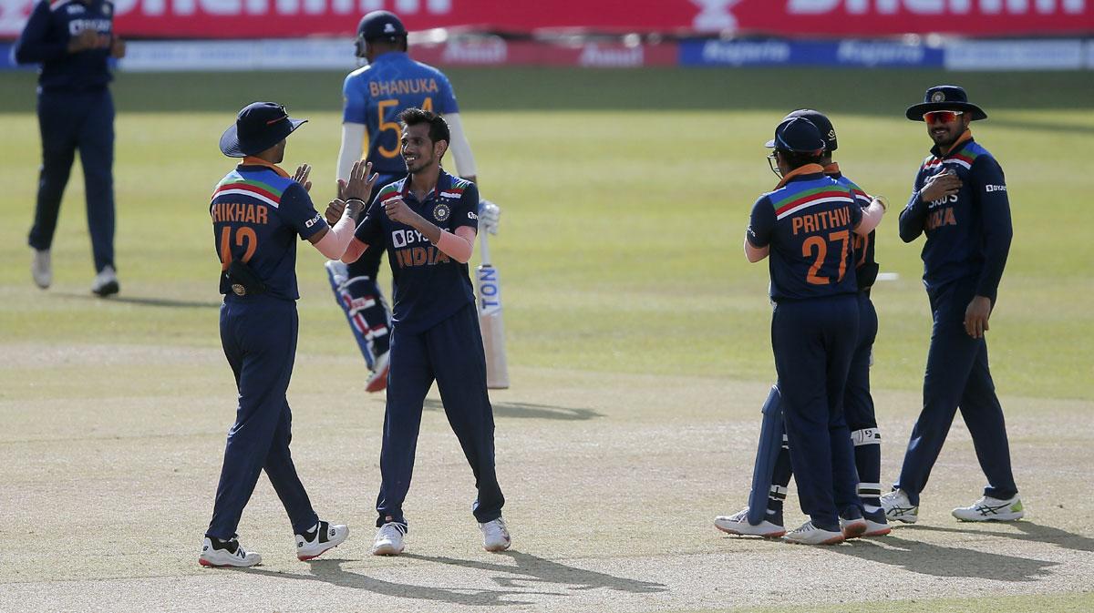 Yuzvendra Chahal is congratulated by skipper Shkhar Dhawan after taking the wicket of Bhanuka Rajapaksa.