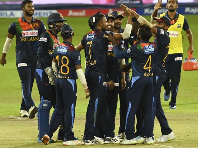 Sri Lanka’s players celebrate the fall of an Indian wicket during the third T20 International against India, in Colombo, on Thursday.