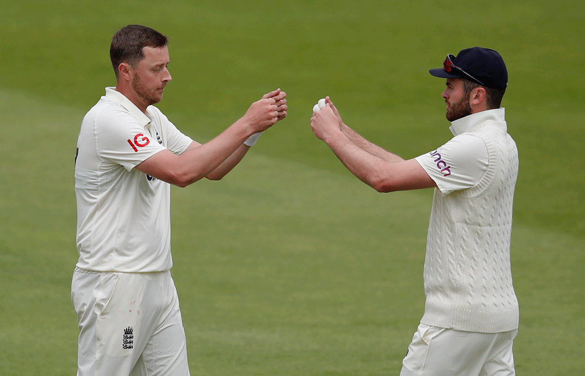 England's Ollie Robinson celebrates with Dom Sibley after taking the wicket of New Zealand's Neil Wagner 