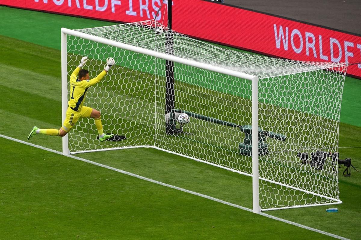 Scotland goalkeeper David Marshall makes a vain attempt to save the Czech Republic's Patrik Schick's (not in pic) goal-bound long range shot after being caught off his line.