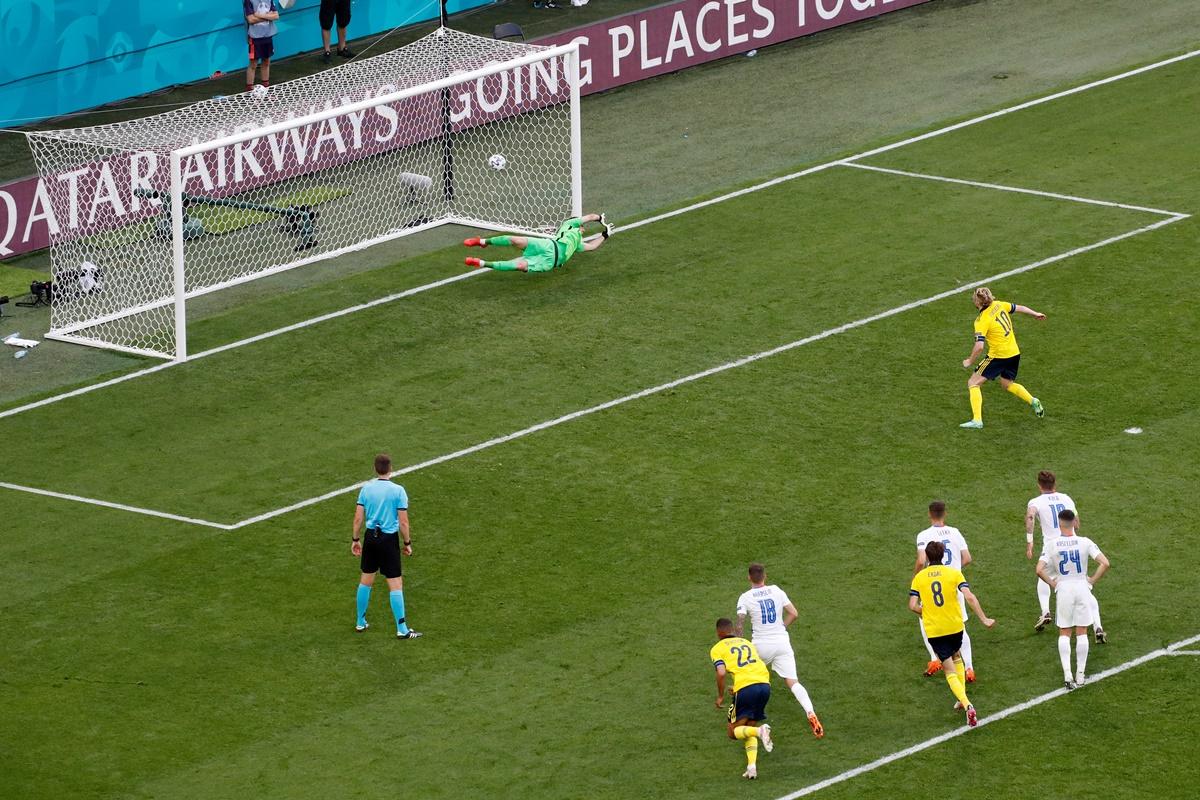 Sweden's Emil Forsberg (No. 10) sends the ball past Slovakia goalkeeper Martin Dubravka from the penalty spot during the Euro 2020 Group E match, at Saint Petersburg stadium, in Russia, on Friday.