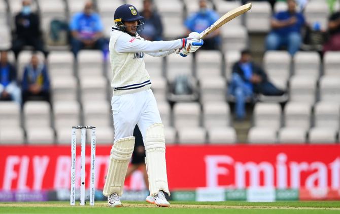 India's Shubman Gill sends the ball to the boundary