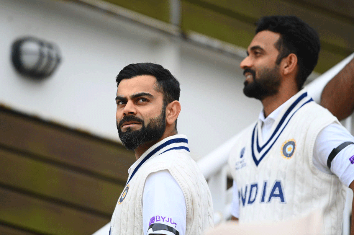 Virat Kohli and Ajinkya Rahane sporting black arm-bands to mourn the Milkha Singh