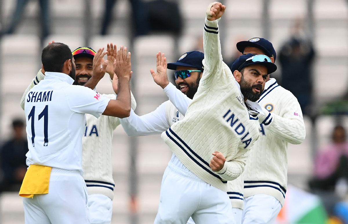 Virat Kohli celebrates the dismissal of Ross Taylor