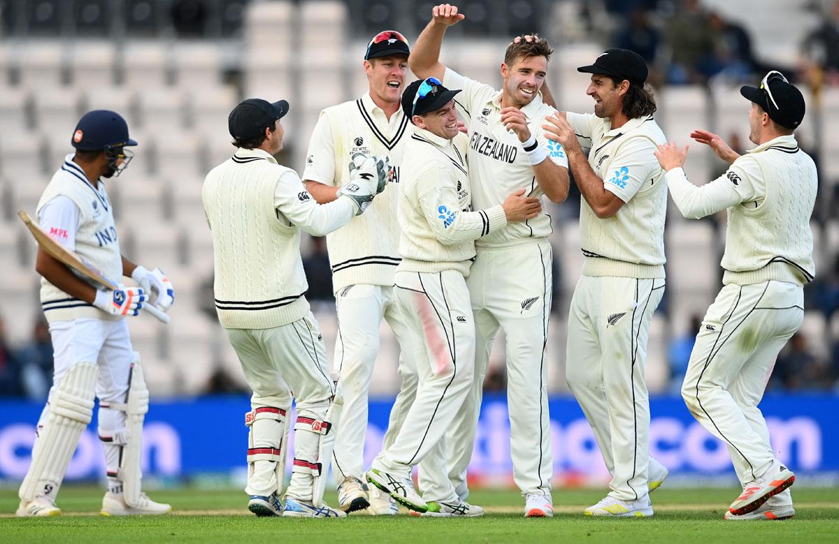 Tim Southee celebrates taking the wicket of Rohit Sharma.