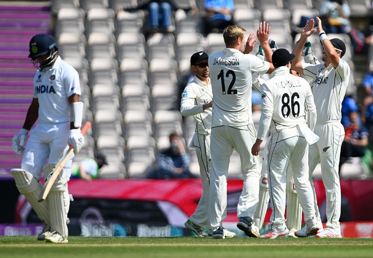 Kyle Jamieson celebrates taking the wicket of Cheteshwar Pujara