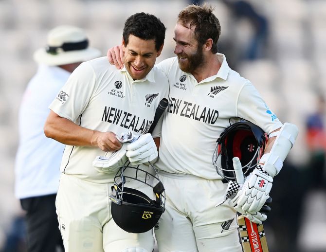 New Zealand batsmen Kane Williamson and Ross Taylor celebrate victory as they walk off after the World Test Championship final against India, at The Hampshire Bowl in Southampton, England, on Wednesday.
