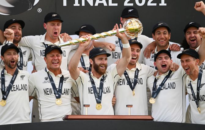  New Zealand captain Kane Williamson lifts the ICC World Test Championship Mace with teammates after winning the WTC final against India in Southampton,