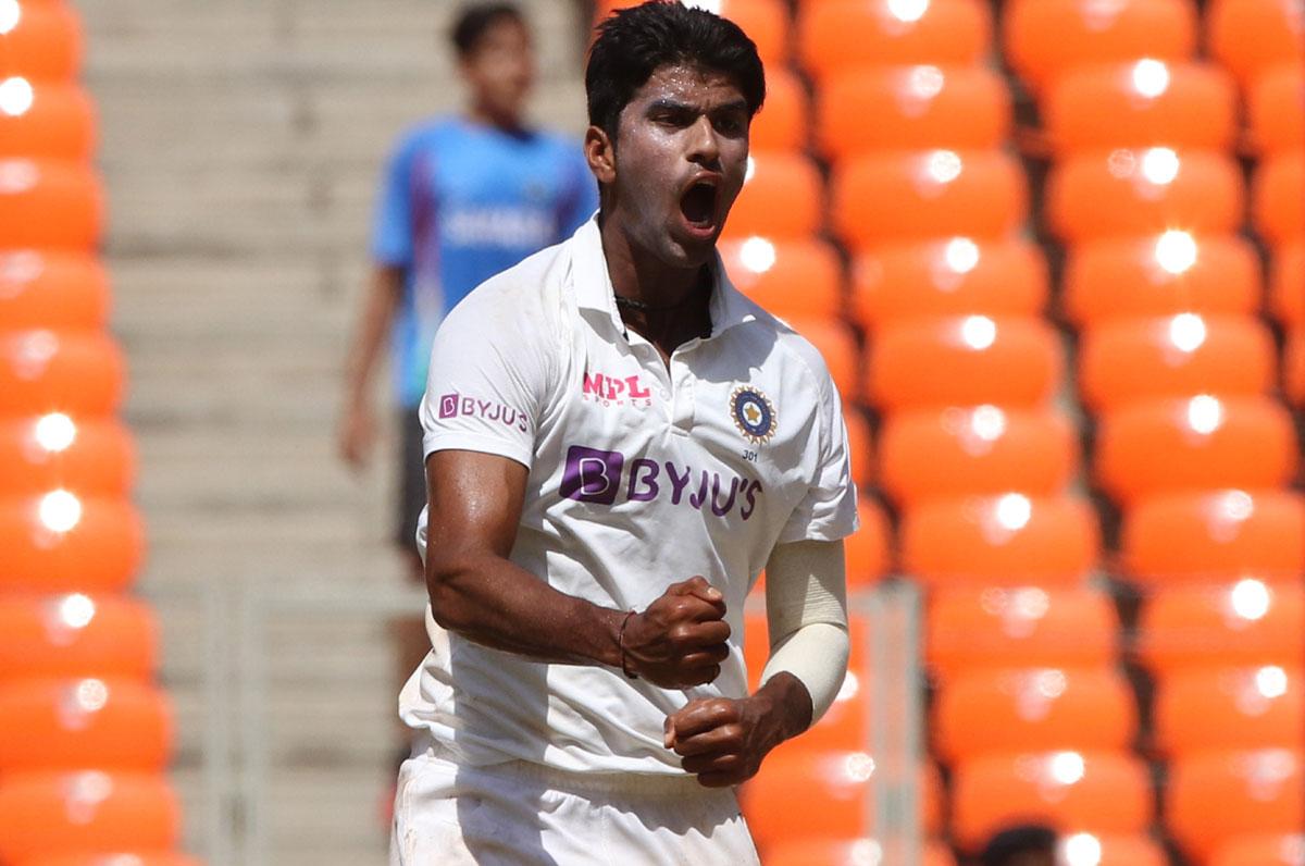 Washington Sundar celebrates the wicket of Ben Stokes.