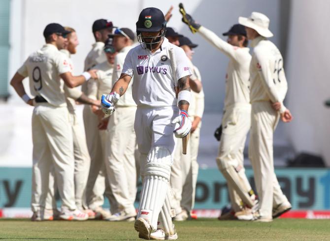 Virat Kohli walks back after being dismissed by Ben Stokes