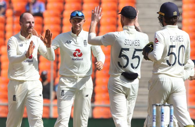 England spinner Jack Leach, left, is congratulated by teammates after dismissing India's Cheteshwar Pujara. 