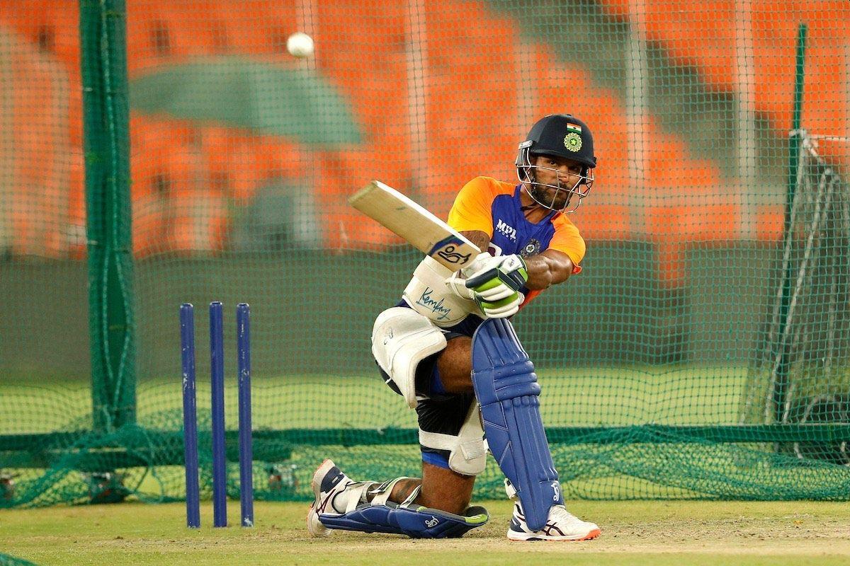 Shikhar Dhawan plays a sweep shots at nets