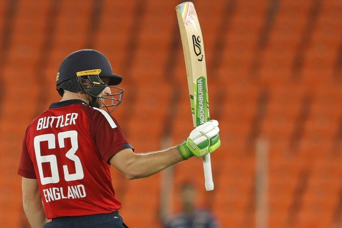 Jos Buttler celebrates after scoring 50