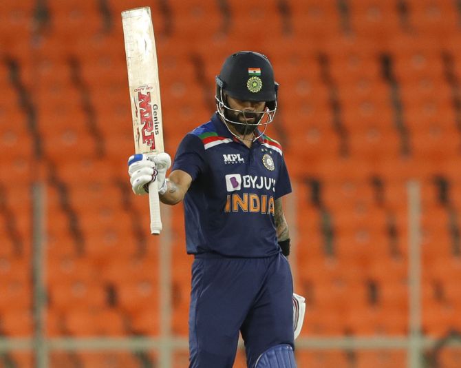 Virat Kohli celebrates after completing his fifty during the third T20I in Ahmedabad on Tuesday.