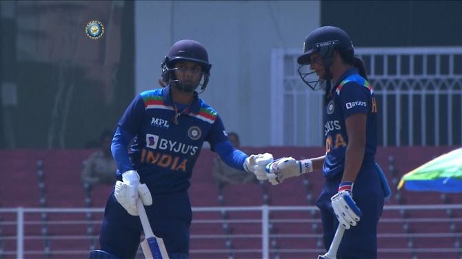 Mithali Raj, left, and Harmanpreet Kaur celebrate their 50 runs partnership during the fifth ODI against South Africa, in Lucknow, on Wednesday.